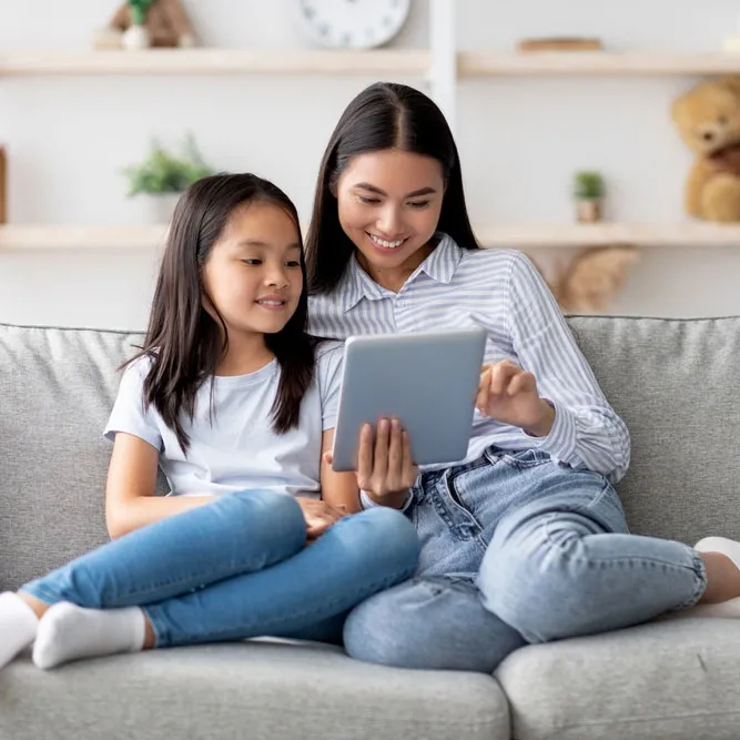 mother daughter surfing internet